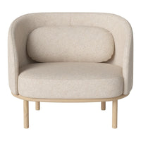 Modern beige chair with a soft, textured fabric and minimalist wooden legs, perfect for a cozy living space.