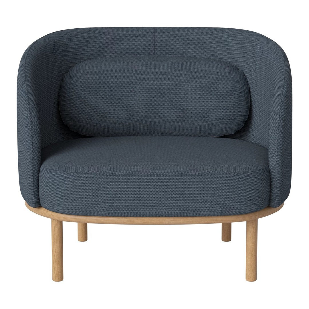Dark blue ribbed fabric armchair with a smooth, rounded design and light wood legs, perfect for modern decor.