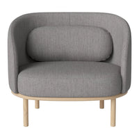 Gray fabric armchair with a rounded back and light wood legs, showcasing a minimalist design.