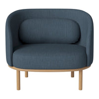 Blue fabric armchair with a rounded design and natural wood legs, featuring a textured pattern for added comfort.