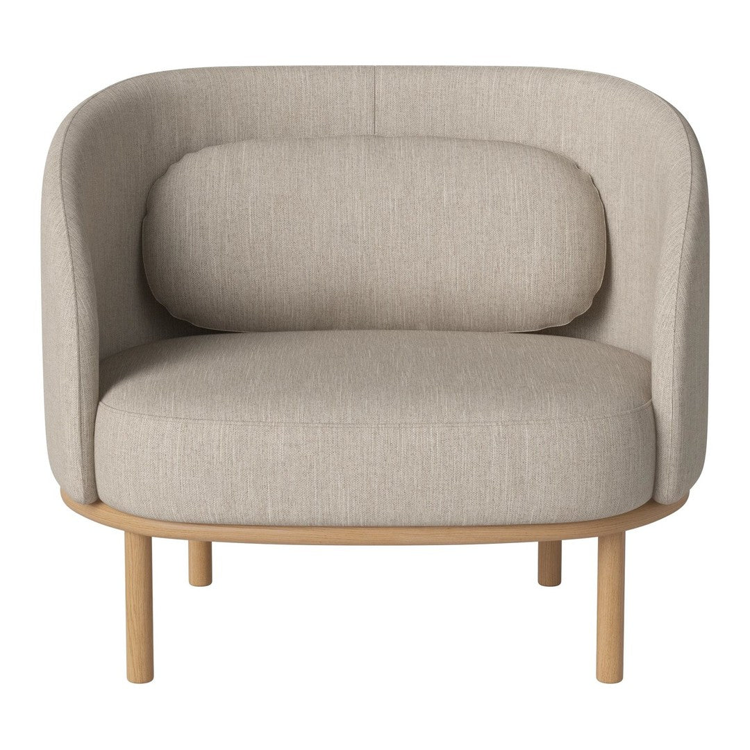 Beige upholstered chair with a curved back and rounded cushions, featuring a smooth, minimalistic design.