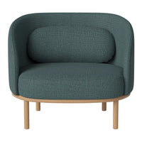 Teal upholstered armchair with a textured pattern and light wooden legs, perfect for modern decor.