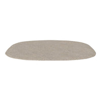 Beige oval rug with a soft, textured surface, featuring a subtle, cozy pattern for a warm ambiance.