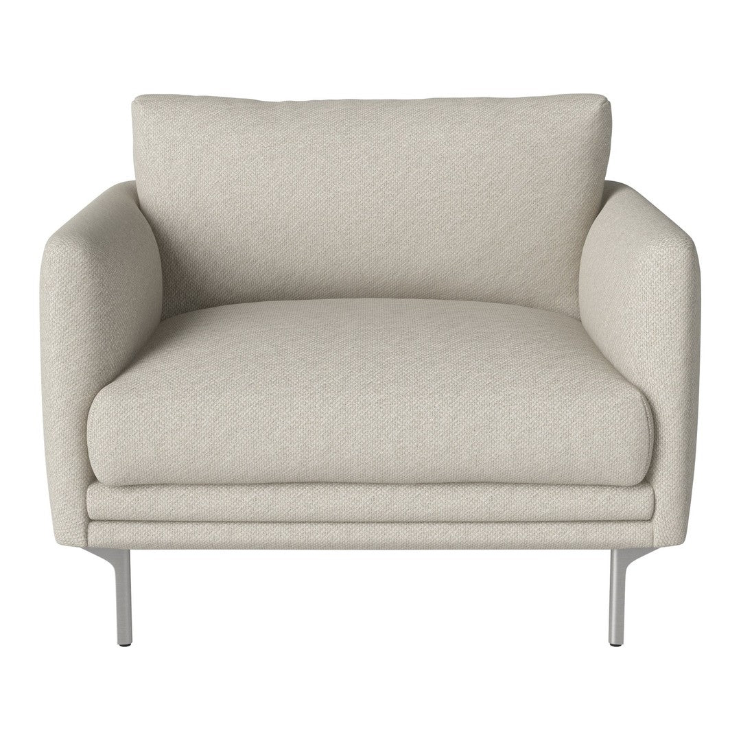 Light beige armchair with soft, textured fabric and minimalist silver legs, perfect for modern decor.