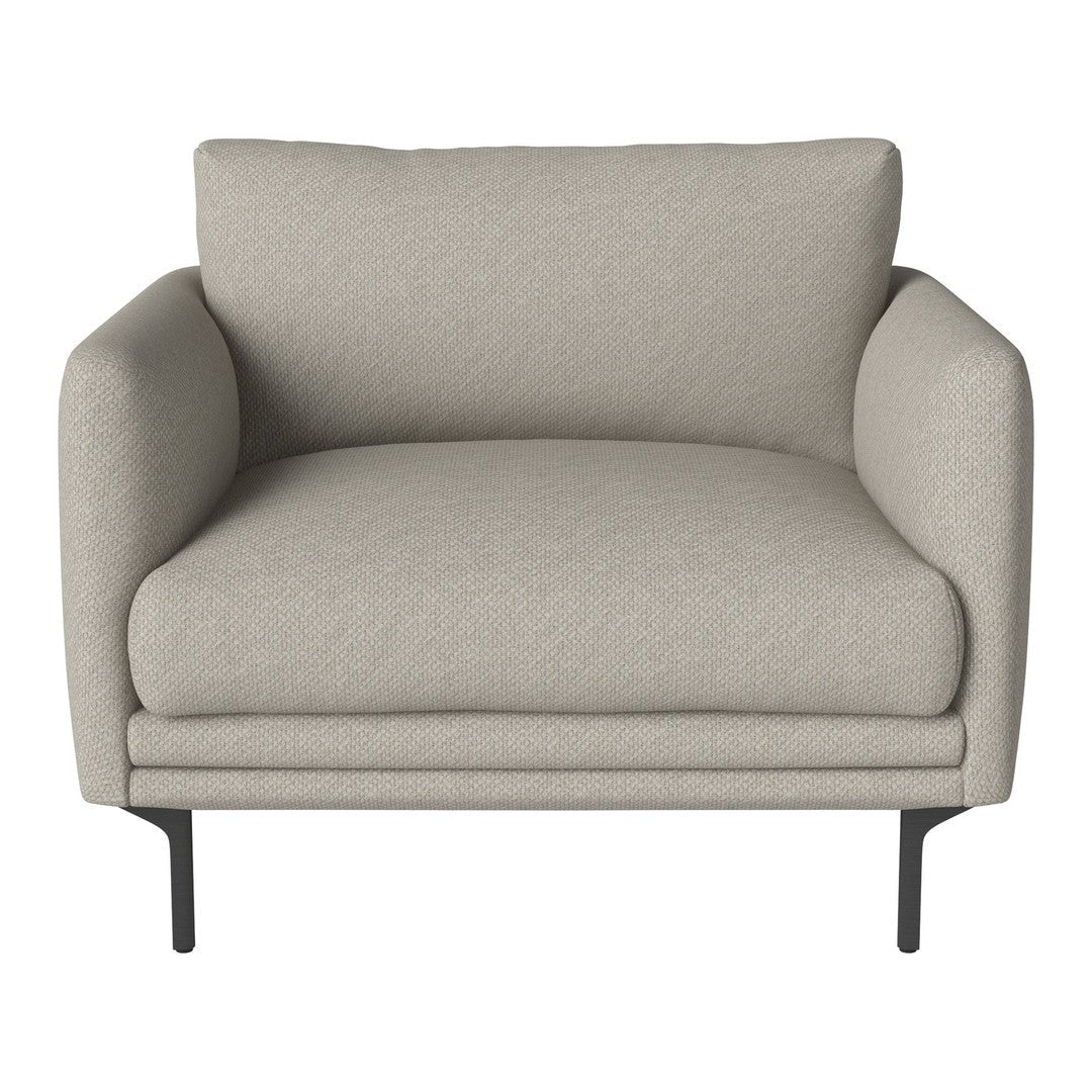 Light beige armchair with a subtle textured pattern and sleek black metal legs. Ideal for modern living spaces.