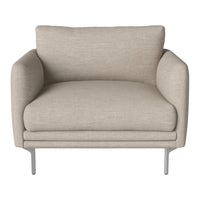Beige upholstered accent chair with smooth texture and sleek silver legs, creating a modern, minimalist aesthetic.
