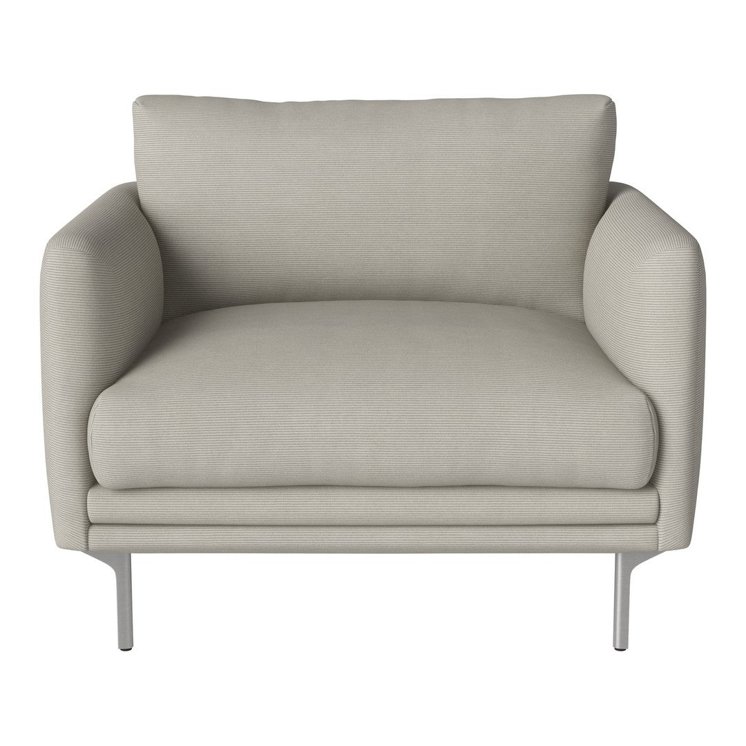 Light beige armchair with smooth fabric and modern metal legs, showcasing a minimalist design.