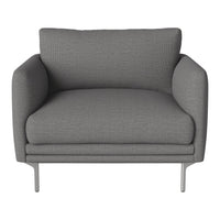 Gray textured armchair with smooth, contemporary design and sleek metal legs. Perfect for modern interiors.