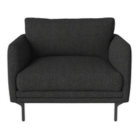 "Modern black lounge chair with a textured upholstery and sleek metal legs."