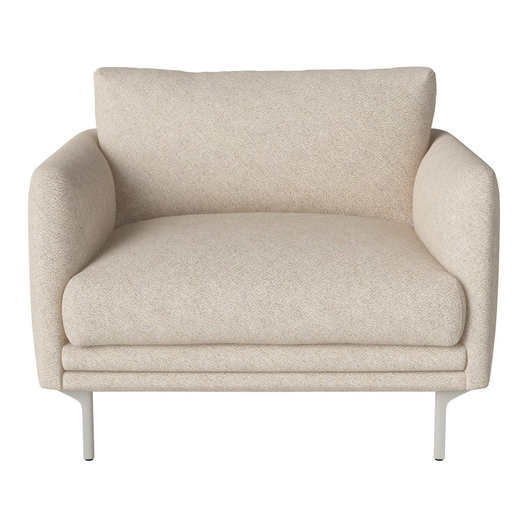 Beige armchair with a subtle textured pattern, complemented by sleek silver legs. Elegant and modern design.