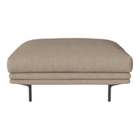 Beige upholstered ottoman with a smooth, rounded top and sleek black metal legs. Minimalist design and warm neutral tones.