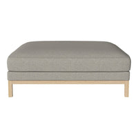 Grey upholstered ottoman with a minimalist wooden base, featuring a smooth, solid color design.