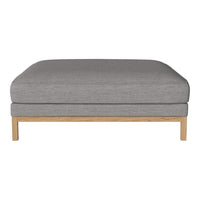 Gray fabric ottoman with a simple, modern design and natural wooden legs. Perfect for minimalist decor.