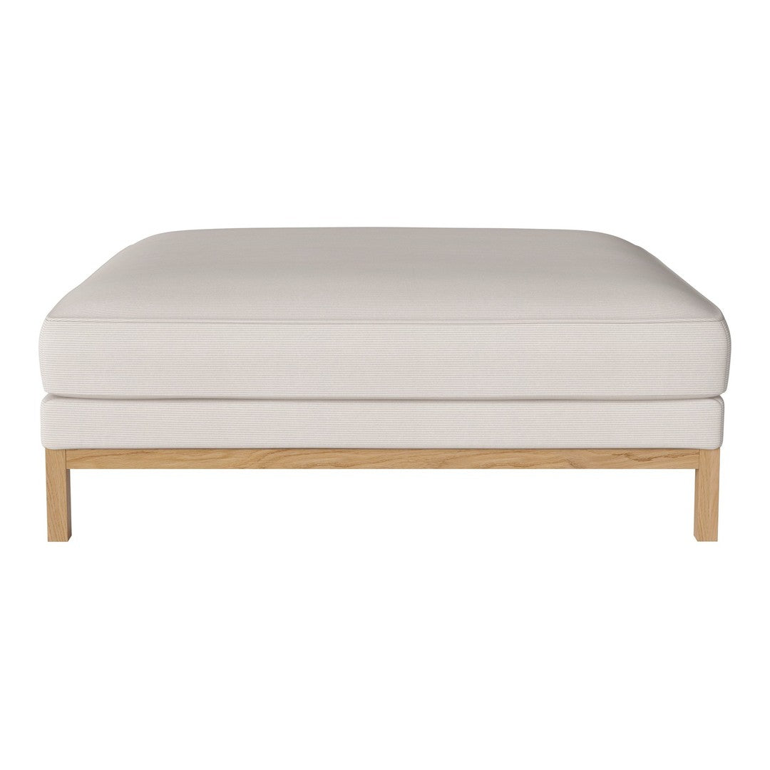 Beige upholstered ottoman with a sleek wooden base, showcasing a minimalist design and smooth, clean lines.