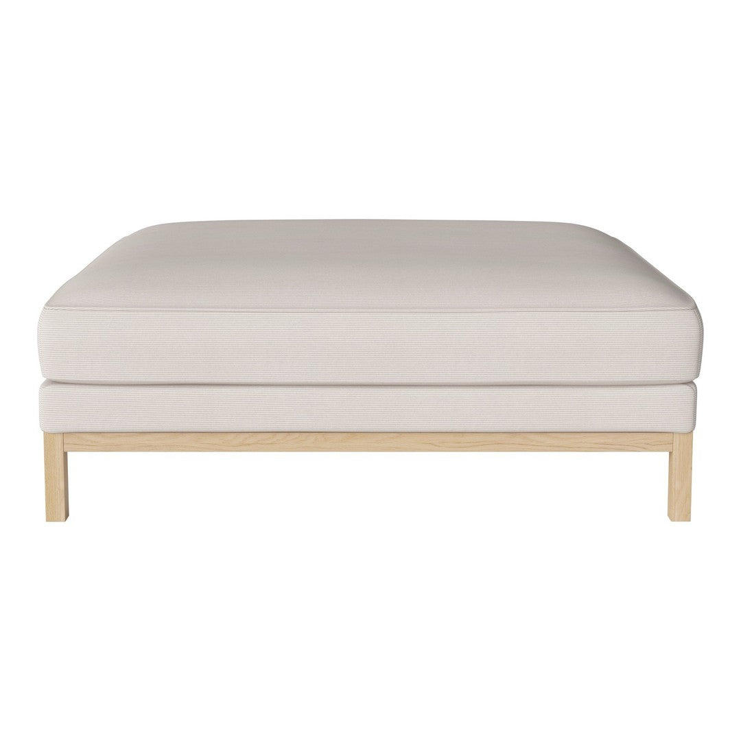 Neutral beige square ottoman with a smooth, solid surface and light wood legs, perfect for modern decor.