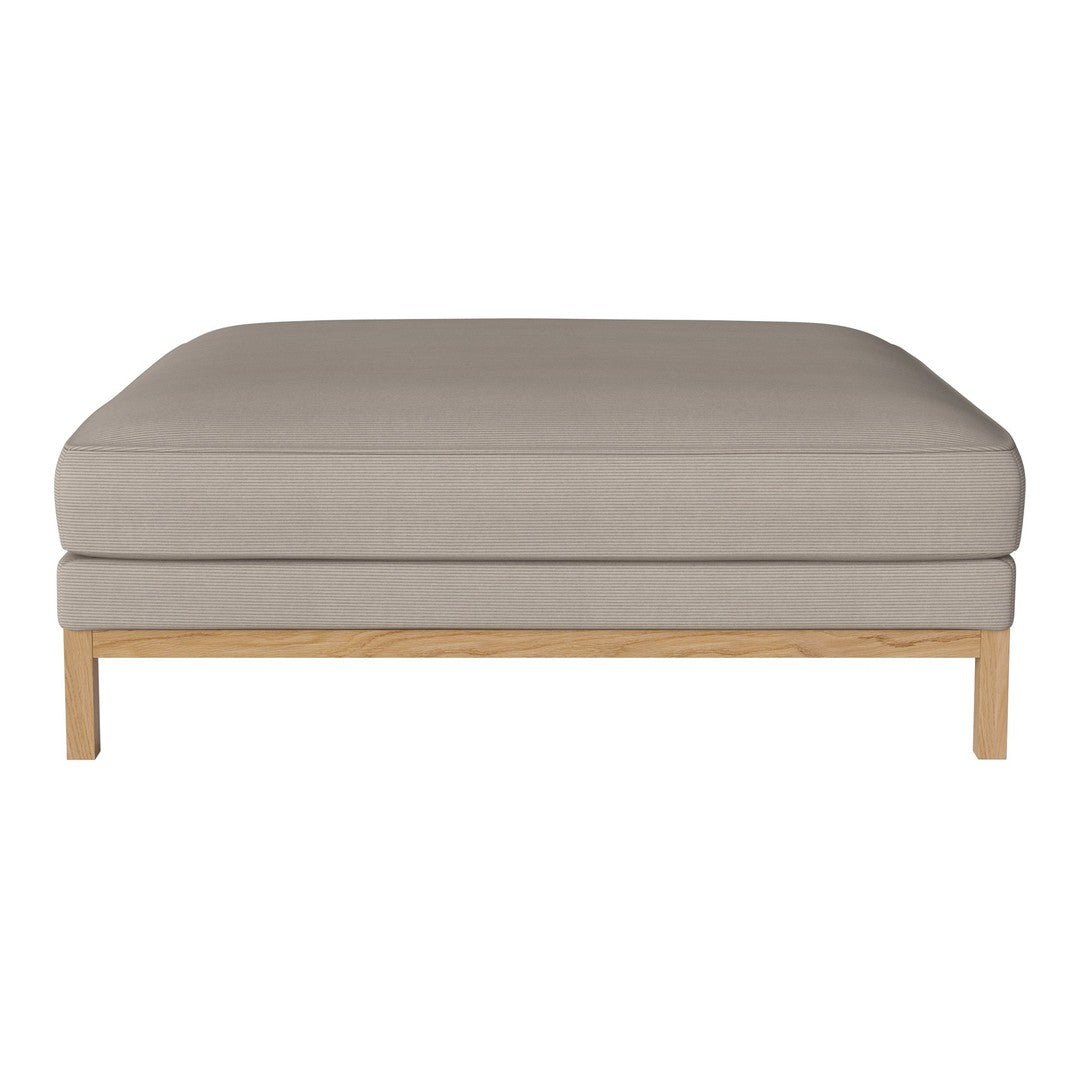 Neutral beige cushion with a smooth texture and light wooden legs, perfect for modern decor.