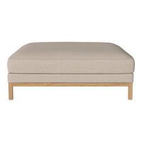 Beige upholstered ottoman with a subtle textured pattern and a light wood frame. Perfect for modern living spaces.