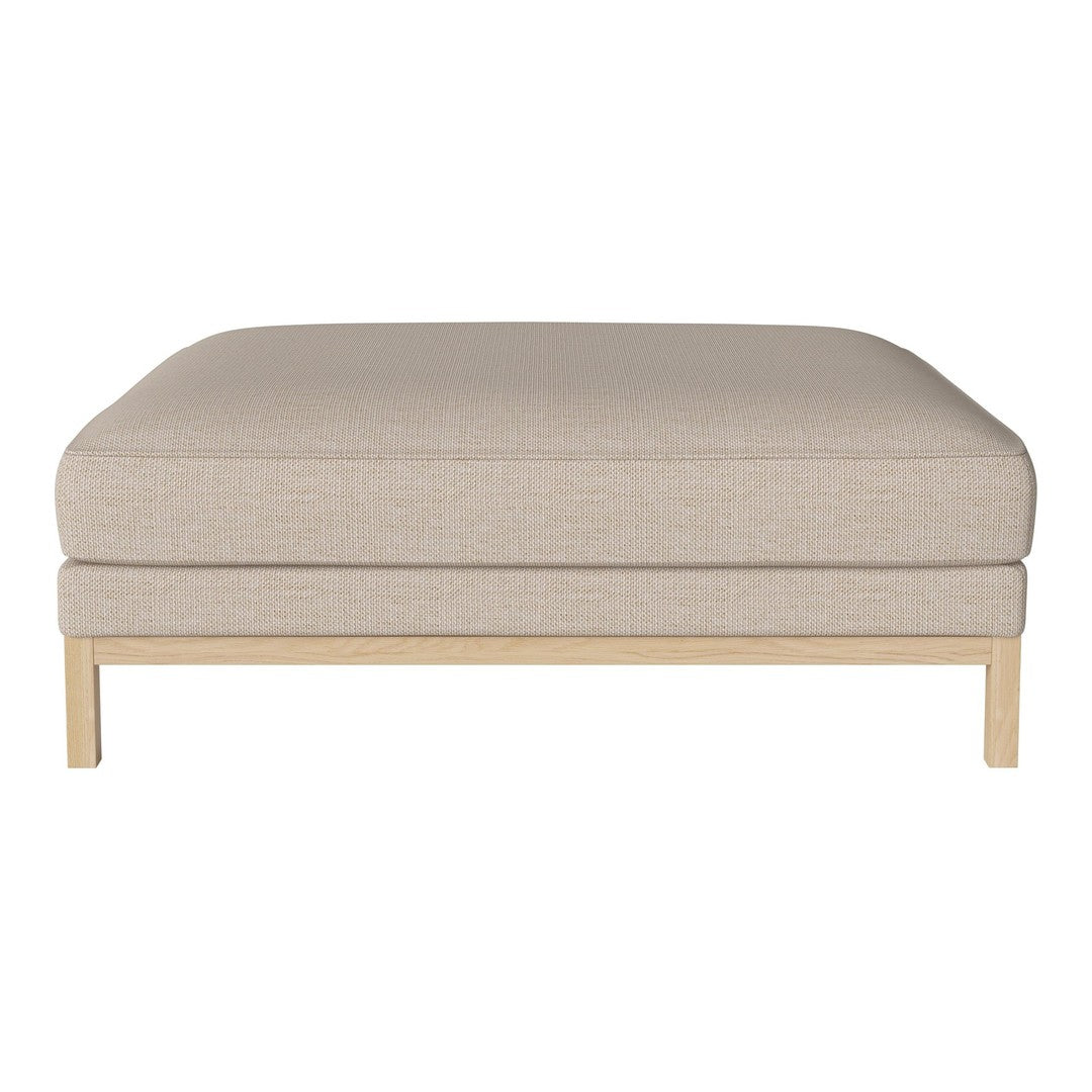 Beige upholstered ottoman with subtle textured pattern and light wood base. Versatile and stylish for any living space.