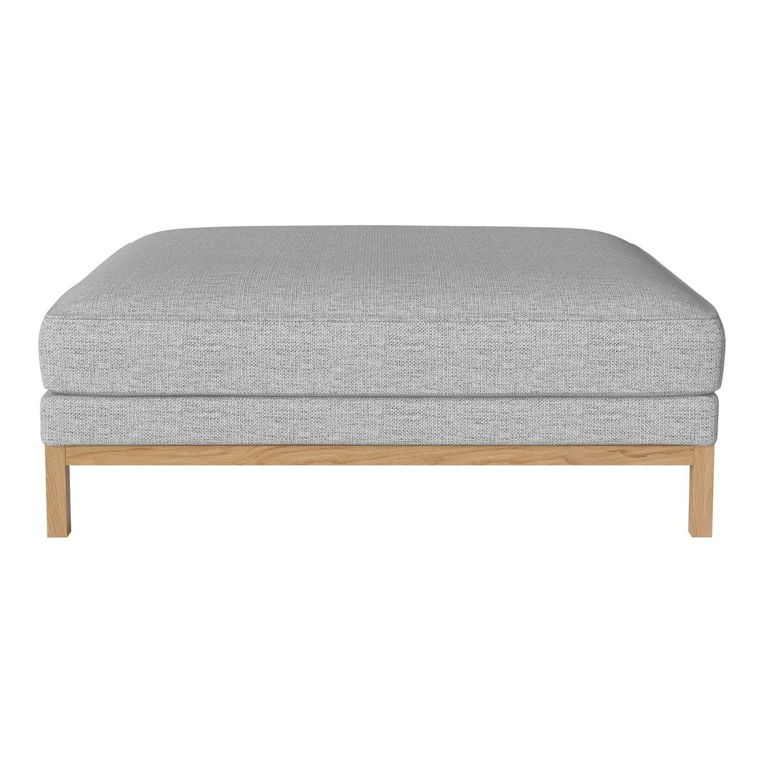 Light gray fabric ottoman with subtle texture and natural wood base, perfect for modern living spaces.