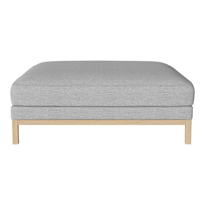 Grey upholstered ottoman with a subtle textured pattern and natural wood base.