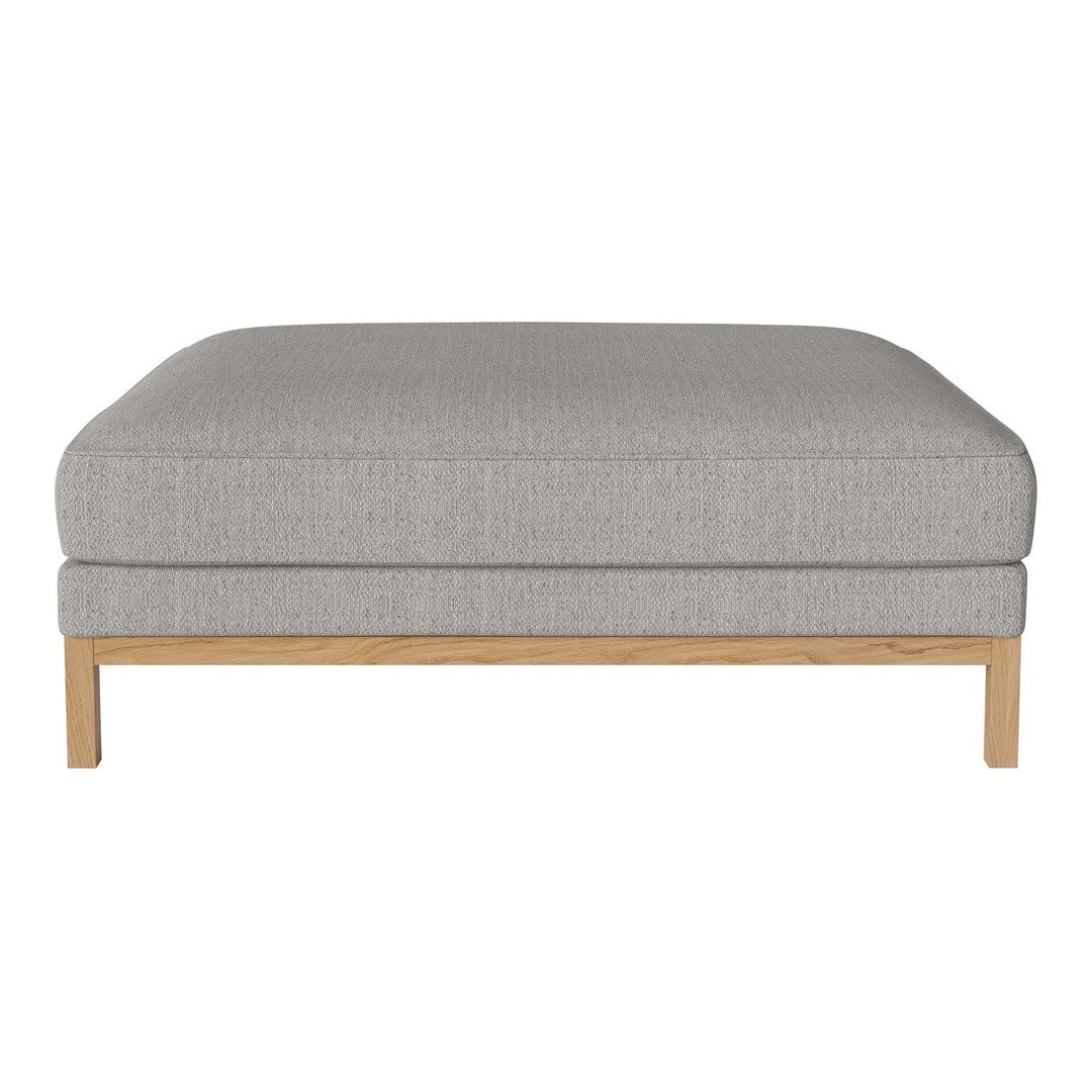 Light gray upholstered ottoman with a smooth texture and natural wood legs, perfect for modern decor.