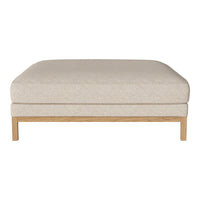 Cream-colored upholstered ottoman with subtle textured pattern and light wood legs. Ideal for modern living spaces.