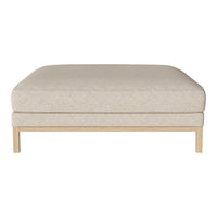 Light beige upholstered ottoman with a smooth texture and minimalist design, featuring a wooden base.