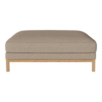 Beige upholstered ottoman with a smooth texture and light wood frame, perfect for modern decor.