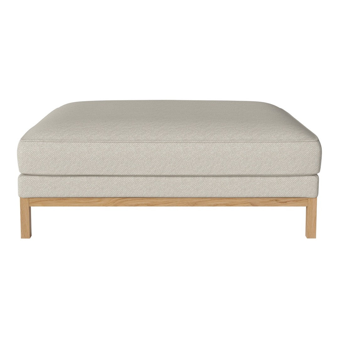 Light beige upholstered ottoman with a textured finish and a natural wood base. Modern and minimalist design.