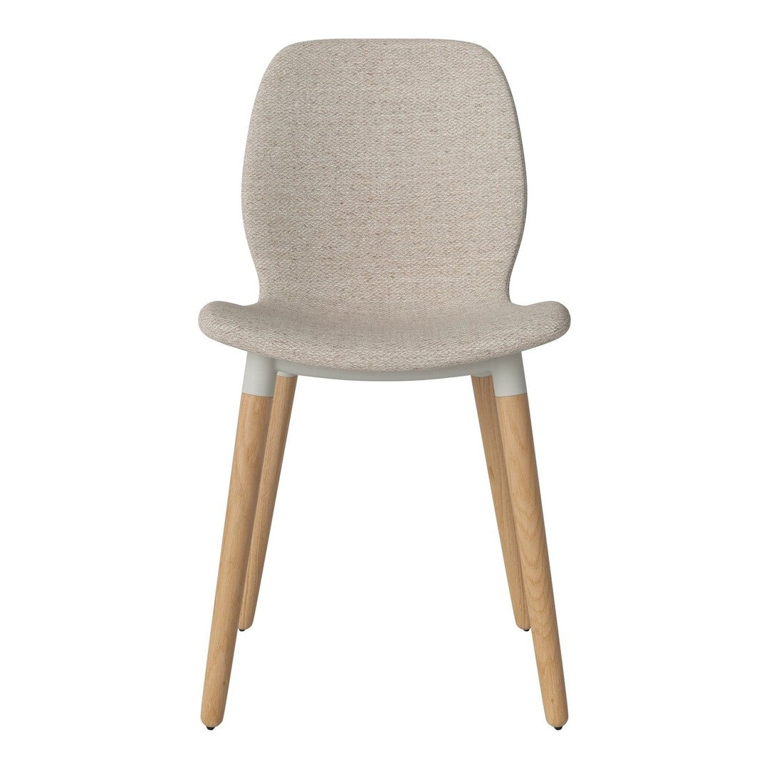 Beige upholstered chair with simple, modern design and light wood legs. Perfect for minimalist decor.