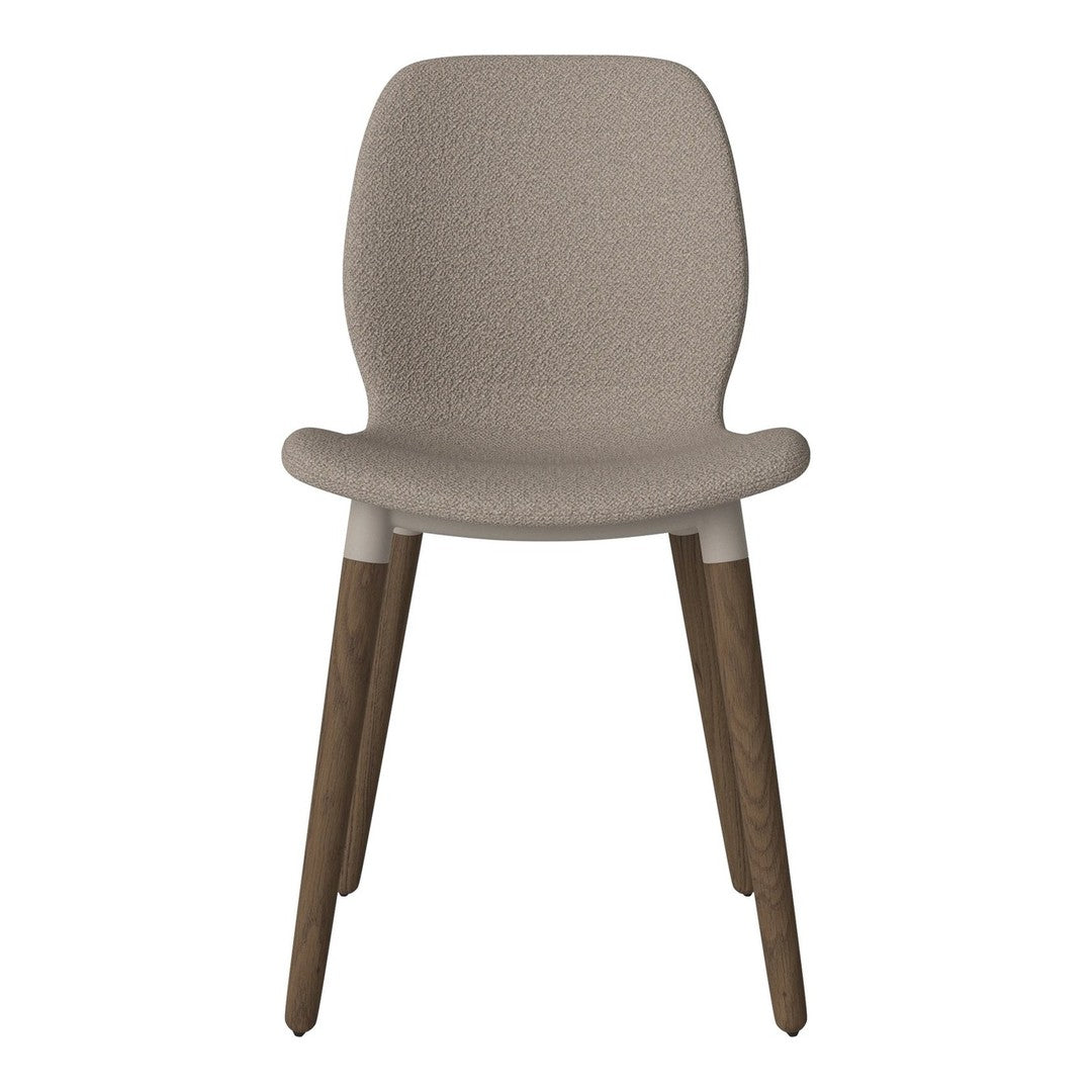 Beige upholstered chair with textured pattern and light wood legs. Modern design for versatile home decor.
