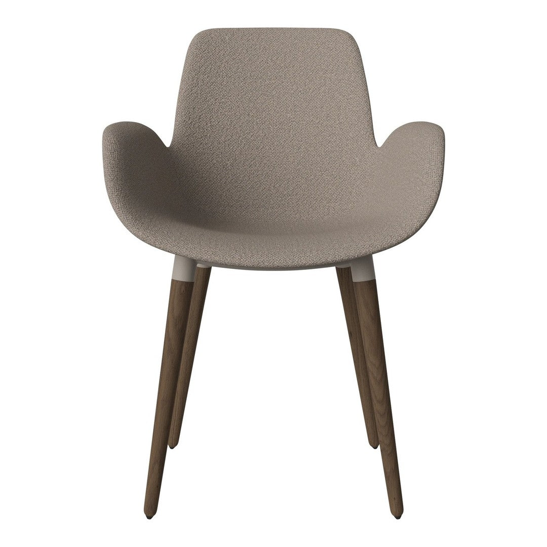 Light beige textured chair with warm wooden legs, perfect for modern decor.