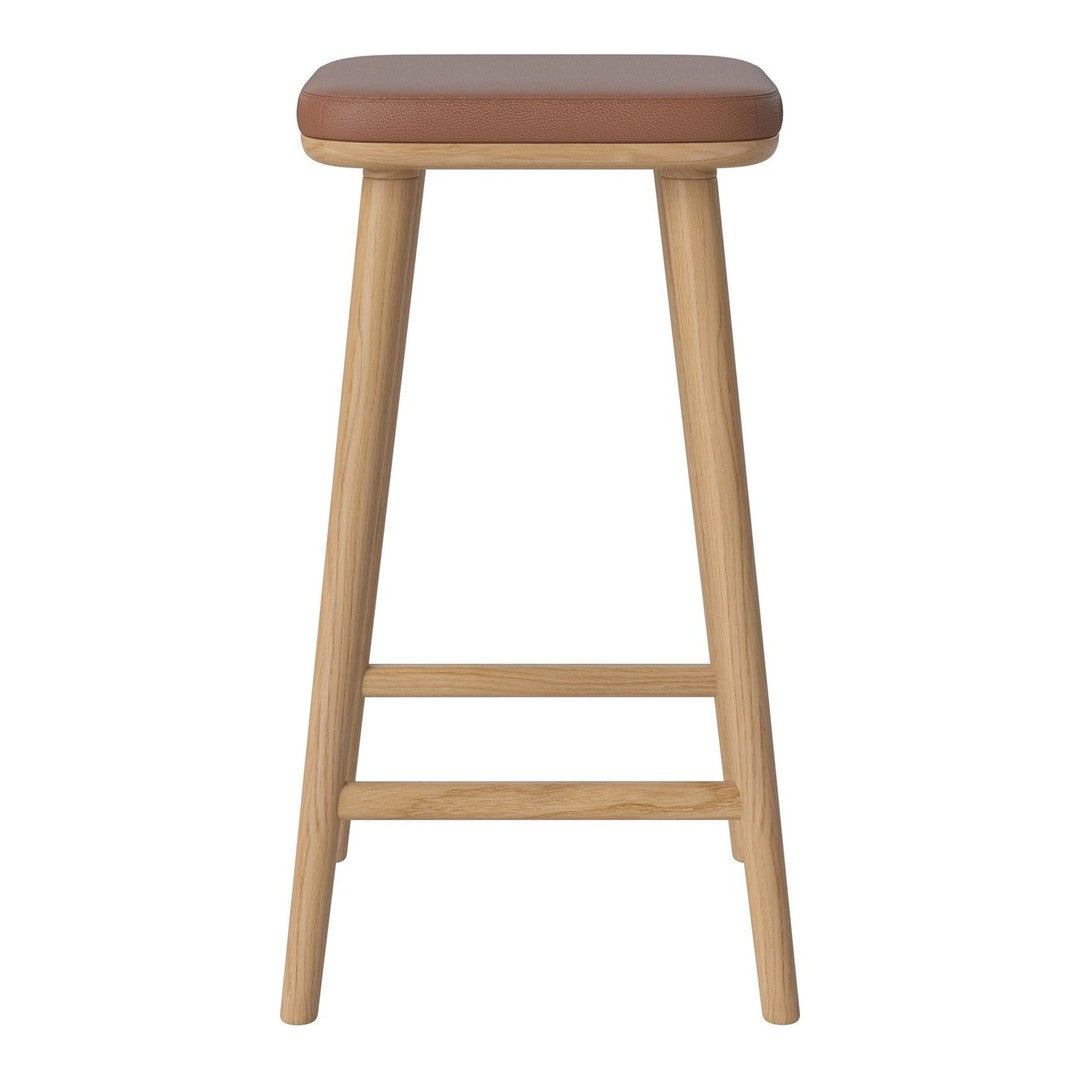 Brown padded stool with a natural wood frame, featuring a minimalist design and smooth finishes. Perfect for any setting.