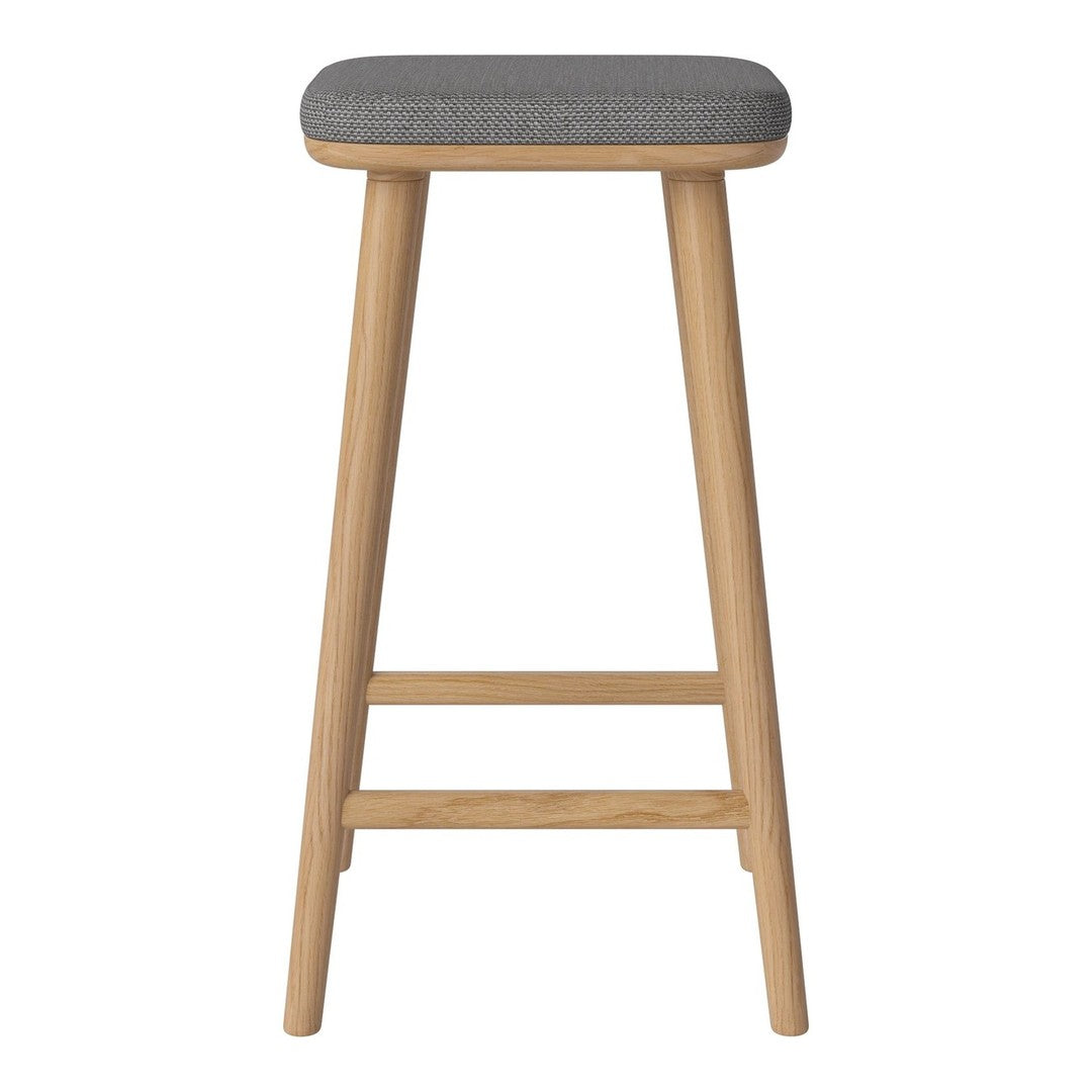 Gray upholstered stool with natural wood legs, featuring a sleek, minimalist design. Perfect for modern decor.