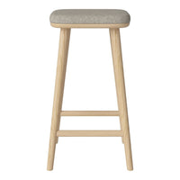 Light wood bar stool with a textured gray fabric seat. Minimalist design featuring soft, neutral tones.