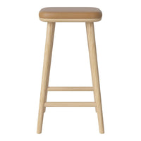 Light wood bar stool with a tan upholstered seat, showcasing a minimalist design and natural color scheme.