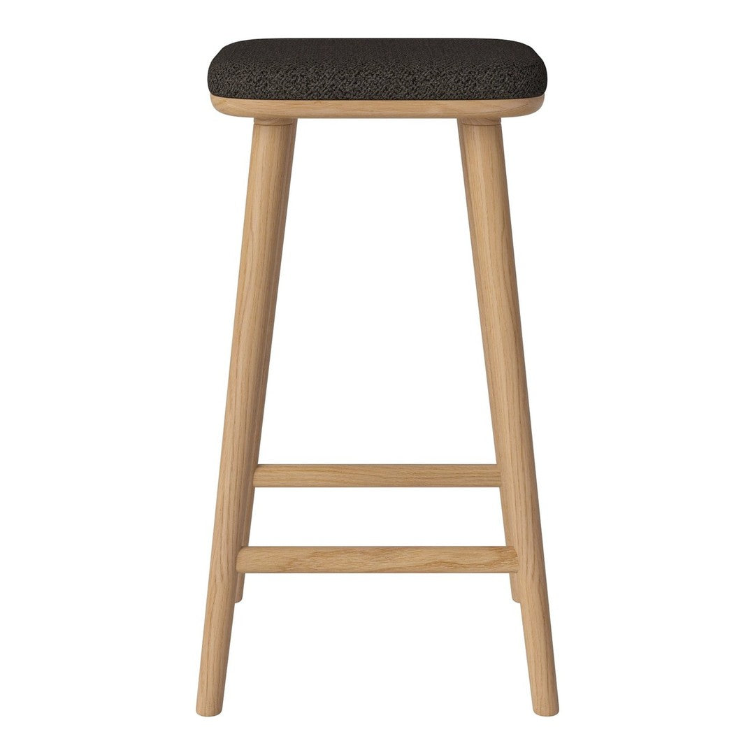Black upholstered stool with natural wood legs, featuring a sleek and modern design. Ideal for kitchens or bars.