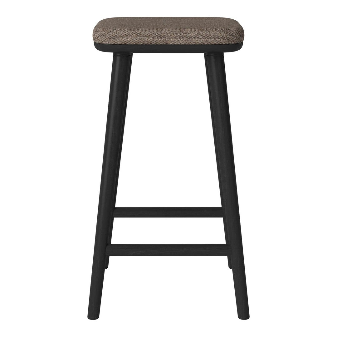 Black wooden stool with a textured brown seat. Simple, modern design suitable for various decor styles.