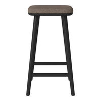Black wooden stool with a textured brown seat. Simple, modern design suitable for various decor styles.