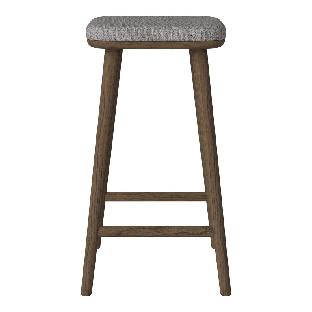 Gray upholstered stool with wooden legs, featuring a simple, modern design and subtle texture.