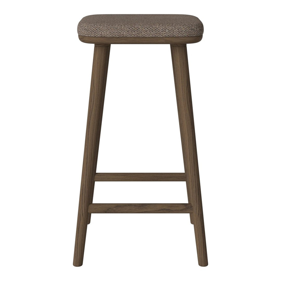 Brown upholstered stool with a textured seat and sleek, dark wooden legs. Ideal for modern or rustic decor.
