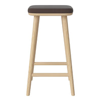 Tall bar stool with a dark wood top and light natural wood legs, showcasing a minimalist design.