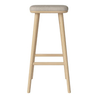 Light wooden bar stool with a soft beige upholstered seat, minimalist design. Perfect for modern kitchens or bars.