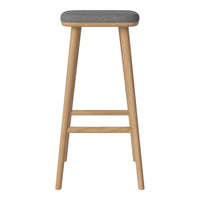Stylish wooden bar stool with a natural finish and a sleek gray upholstered seat.
