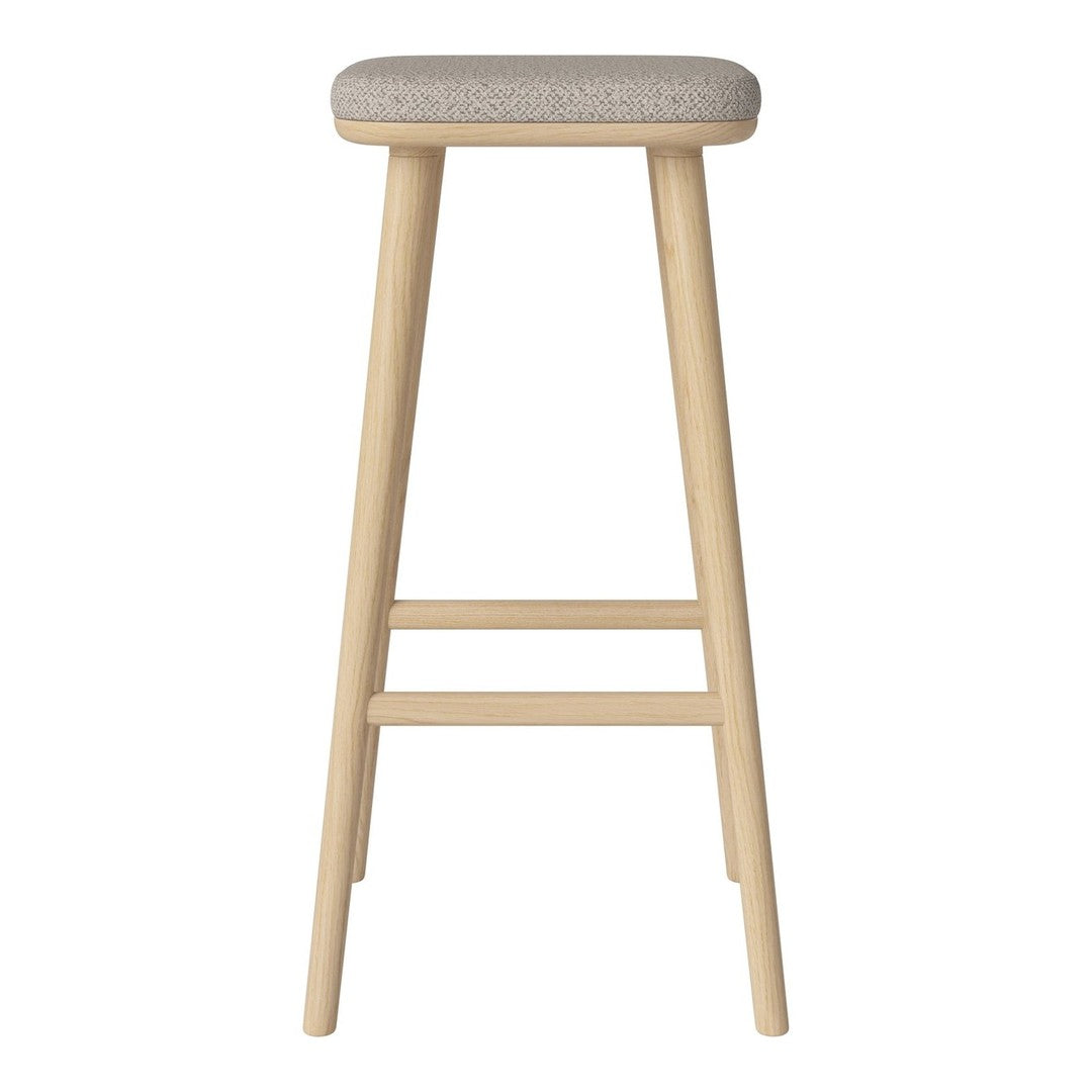 Light wood bar stool with a textured gray upholstered seat. Simple, modern design with natural tones.
