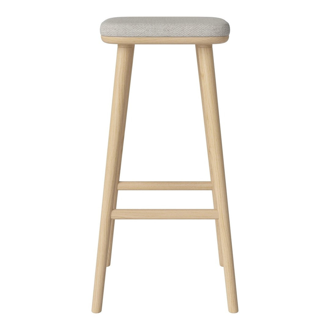 Light wood bar stool with a soft, neutral gray cushion. Stylish and minimalist design with clean lines.