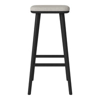 Modern bar stool featuring a sleek black frame and a light gray upholstered seat. Minimalist design with clean lines.