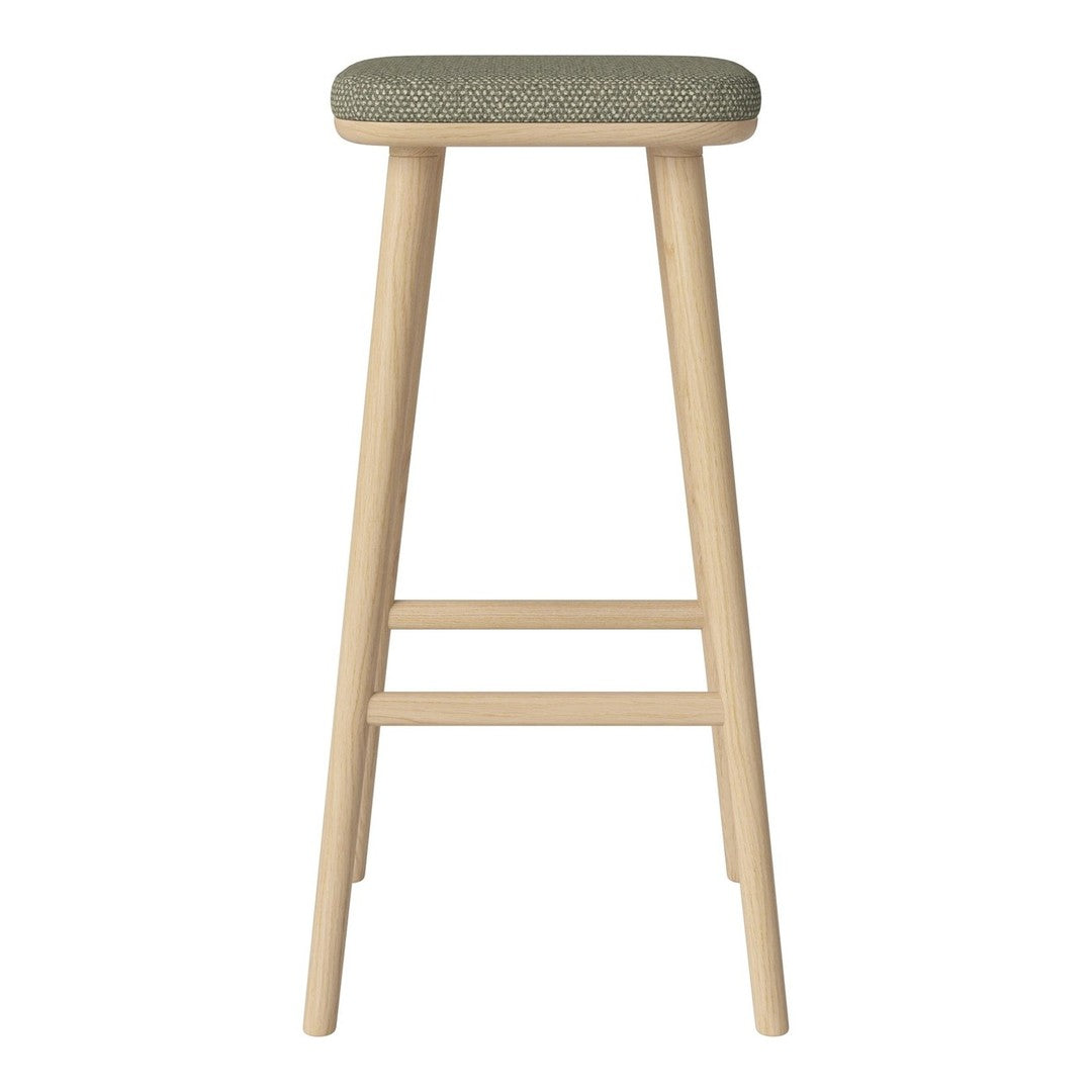 Wooden bar stool with natural finish and a textured olive green fabric seat. Simple and modern design.
