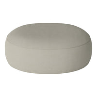 Round beige pouf with a smooth, solid texture, perfect for modern home decor. Ideal for versatile styling options.
