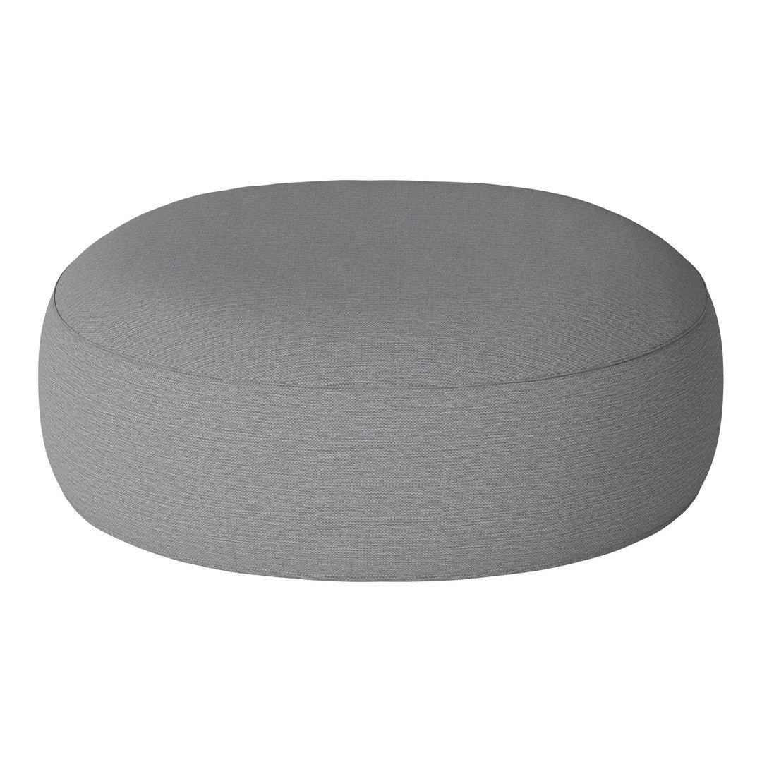 Round gray pouf with a textured fabric surface, perfect for modern decor.